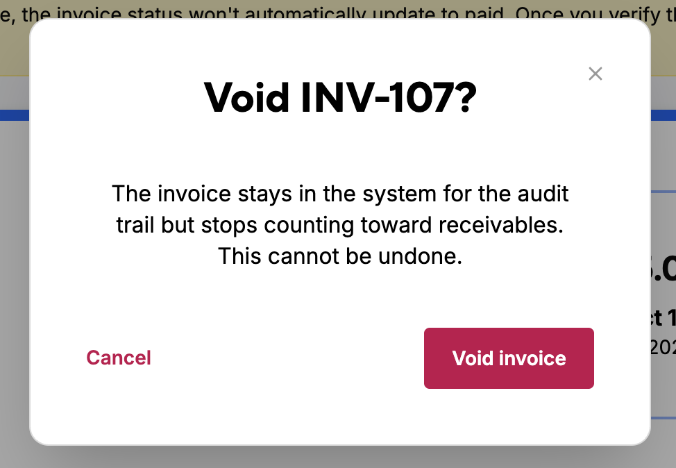 The Void invoice confirmation dialog explaining that a voided invoice stays in the audit trail